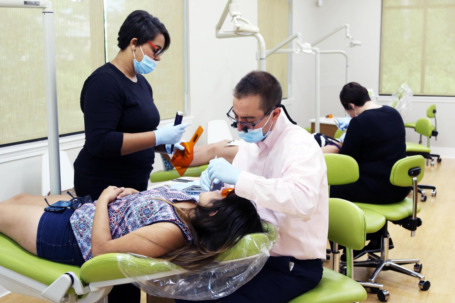 Dr. Juan working on patient
