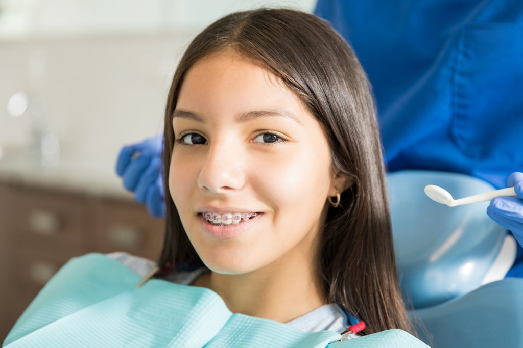 Girl getting her teeth checked