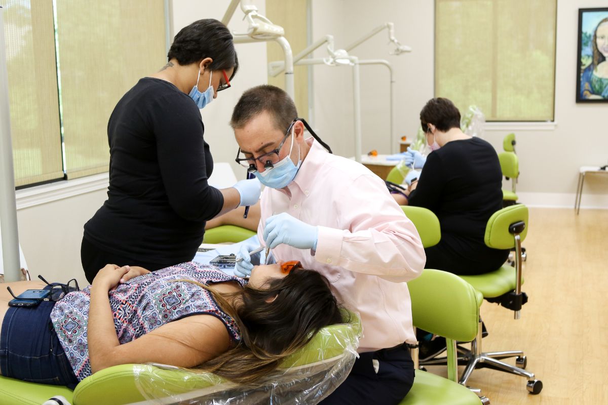 Dr. Juan working on a patient's teeth