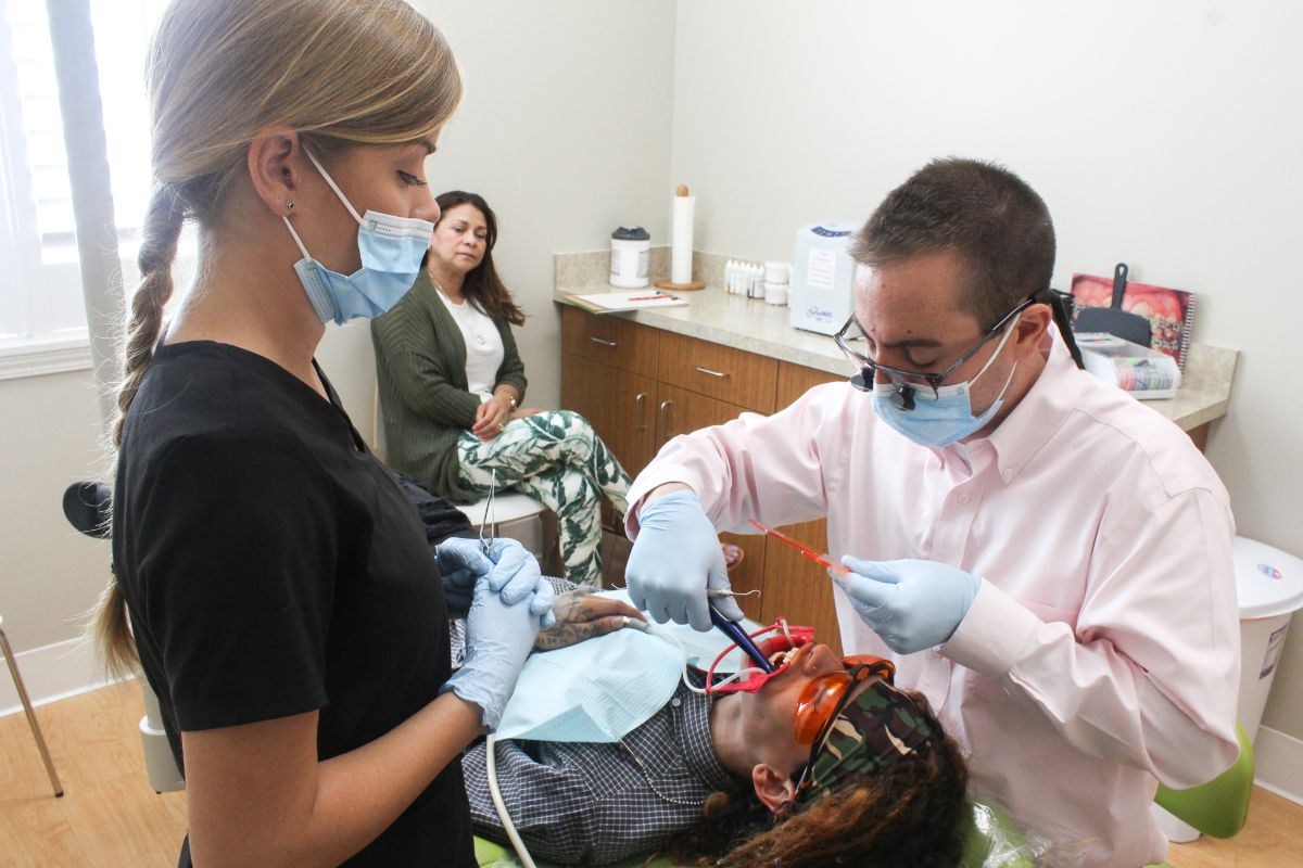 Dr. Juan working on a patient's teeth